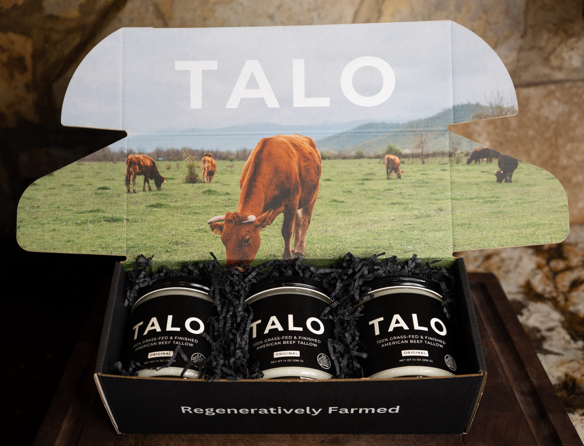 TALO beef tallow three-pack in a box printed with grazing cattle artwork, labeled Regeneratively Farmed